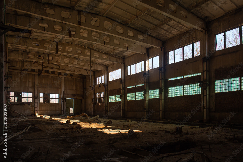Abandoned ruined industrial factory building, corridor view with perspective, ruins and demolition concept Abandoned ruined industrial factory building, corridor view with perspective, ruins and demolition concept