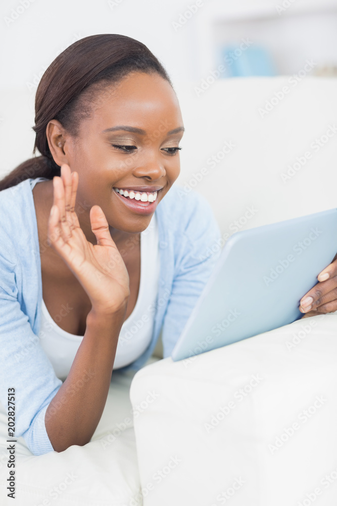 Black woman lying on front while smiling Black woman lying on front while smiling