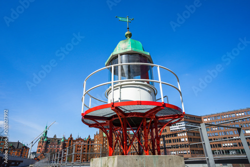 Old beacon or small lighthouse in Hamburg Hafencity photo