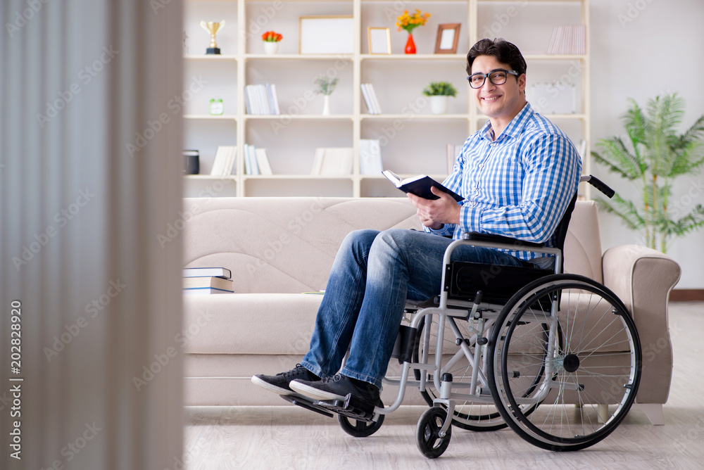 Young student on wheelchair in disability concept Young student on wheelchair in disability concept