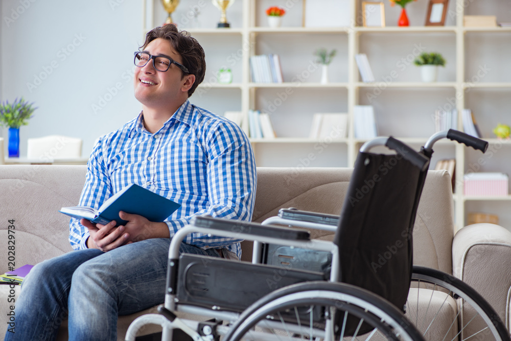 Young student on wheelchair in disability concept Young student on wheelchair in disability concept
