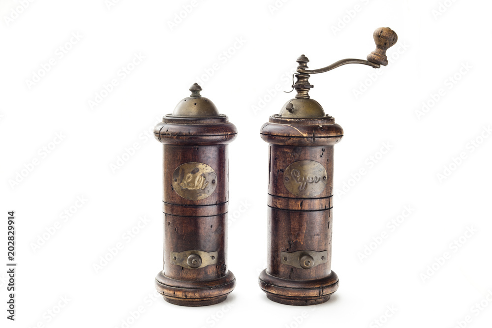 Detail of salt shaker or saltbox and pepper in white background Detail of salt shaker or saltbox and pepper in white background