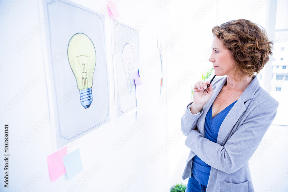 Fototapeta premium Creative business looking at poster 