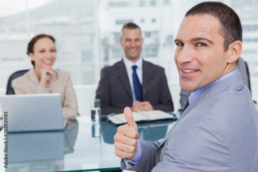 Applicant giving thumb up after obtaining the job Applicant giving thumb up after obtaining the job