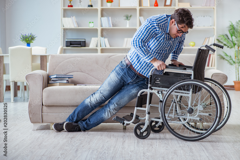 Young student on wheelchair in disability concept Young student on wheelchair in disability concept