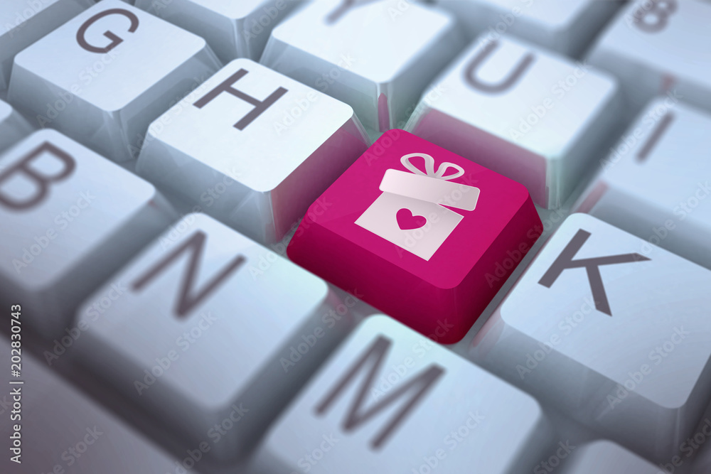 gift with heart against pink key on keyboard gift with heart against pink key on keyboard