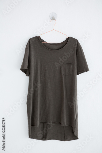 Grey t-shirt with pocket on hanger