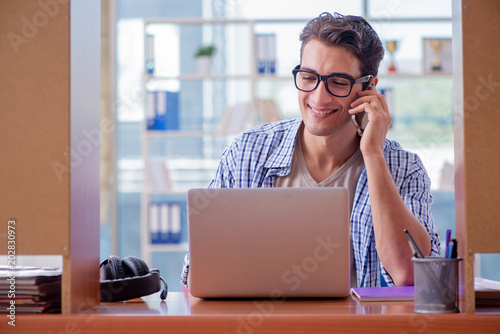 Student studying at home preparing for exam © Elnur