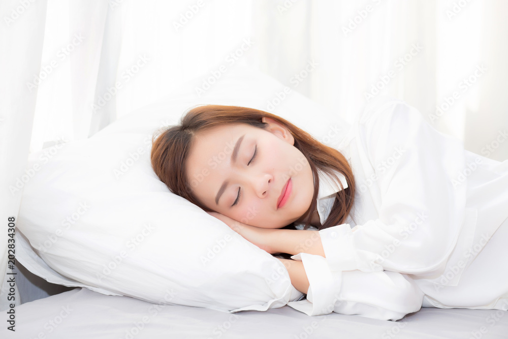 Beautiful asian young woman sleeping lying in bed on bedroom with head on pillow comfortable and happy, girl with relax for health welness and lifestyle concept. Beautiful asian young woman sleeping lying in bed on bedroom with head on pillow comfortable and happy, girl with relax for health welness and lifestyle concept.