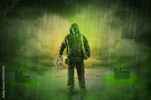 Masked unrecognizable guard in an abandoned space after explosion

