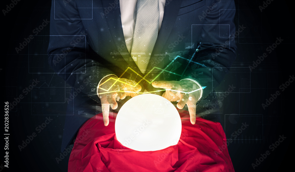 Φωτογραφία Young businessman making predictions of the future of the stock market with a ma