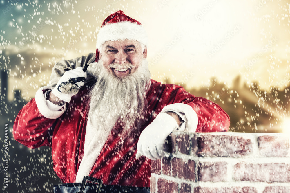 Portrait of Santa Claus carrying bag full of gifts against picture of city by sunrise Portrait of Santa Claus carrying bag full of gifts against picture of city by sunrise
