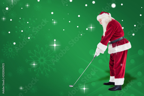 Santa Claus is playing golf against green snowflake background