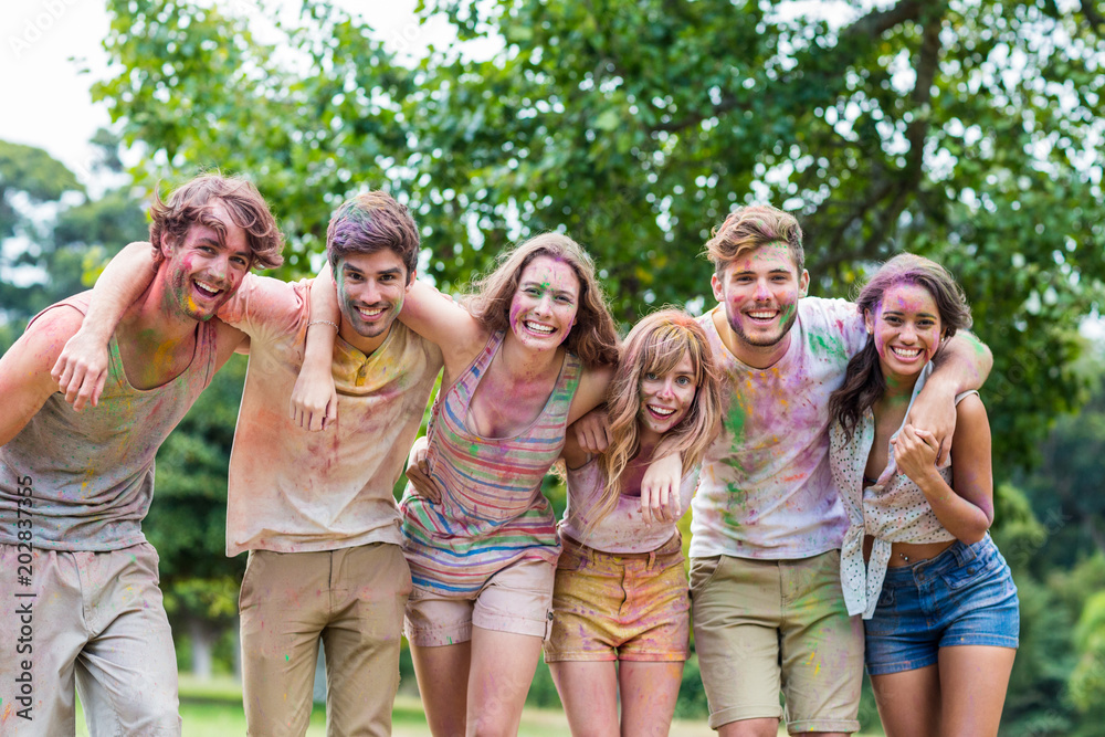 Happy friends covered in powder paint Happy friends covered in powder paint