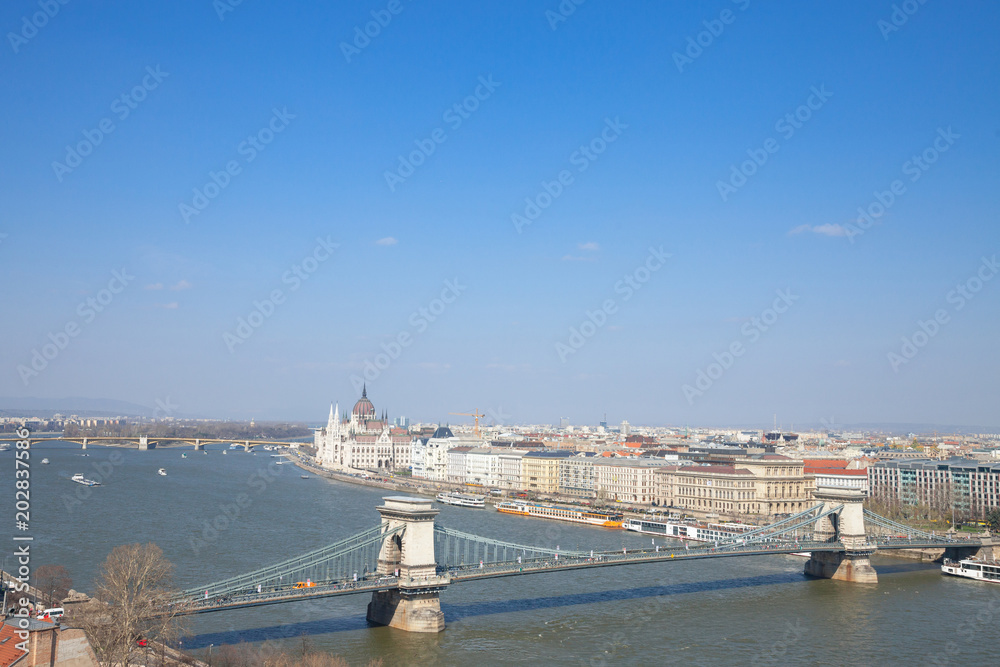 Panorama of Budapest with the Hungarian Parliament (orszaghaz) seen from the Budapest castle, the Danube river being in front with the Szechenyi bridge in front