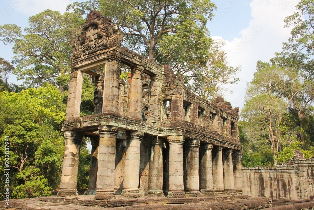 Fototapeta premium Ancient ruins structure in Angkor Wat Temples area in Siem Reap, Cambodia. Unesco World Heritage Site. Travel destination, tour guide, visit concept