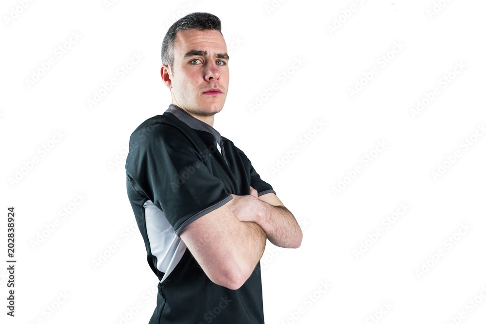 Fototapeta premium Frowning rugby player with arms crossed