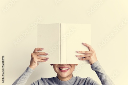 An Asian Woman Reading a Book