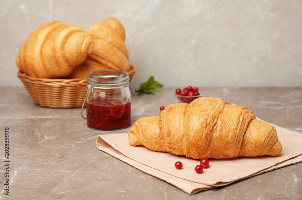 Tasty croissant served for breakfast on table