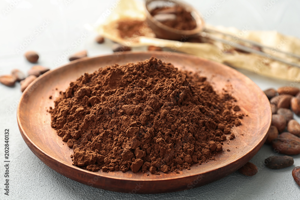 Plate with cocoa powder on table Plate with cocoa powder on table