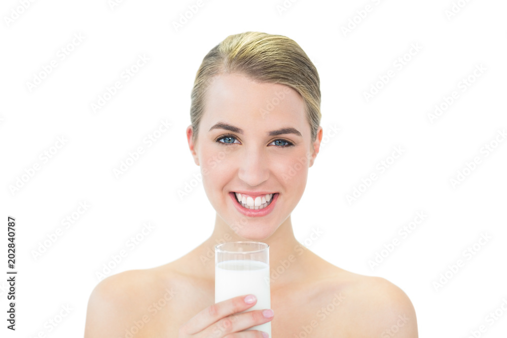 Smiling attractive blonde holding glass of milk Smiling attractive blonde holding glass of milk