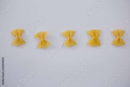 Farfalle pasta arranged in a row
