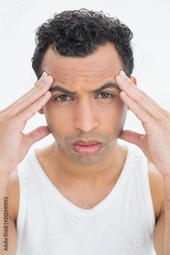 Closeup portrait of a man suffering from headache