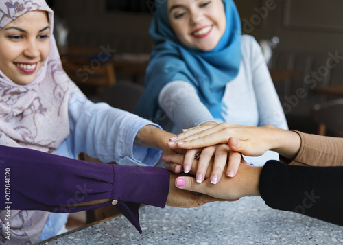 Islamic friends hands stack for teamwork © Rawpixel.com