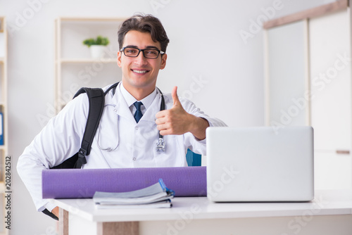 Doctor going to gym during lunch break