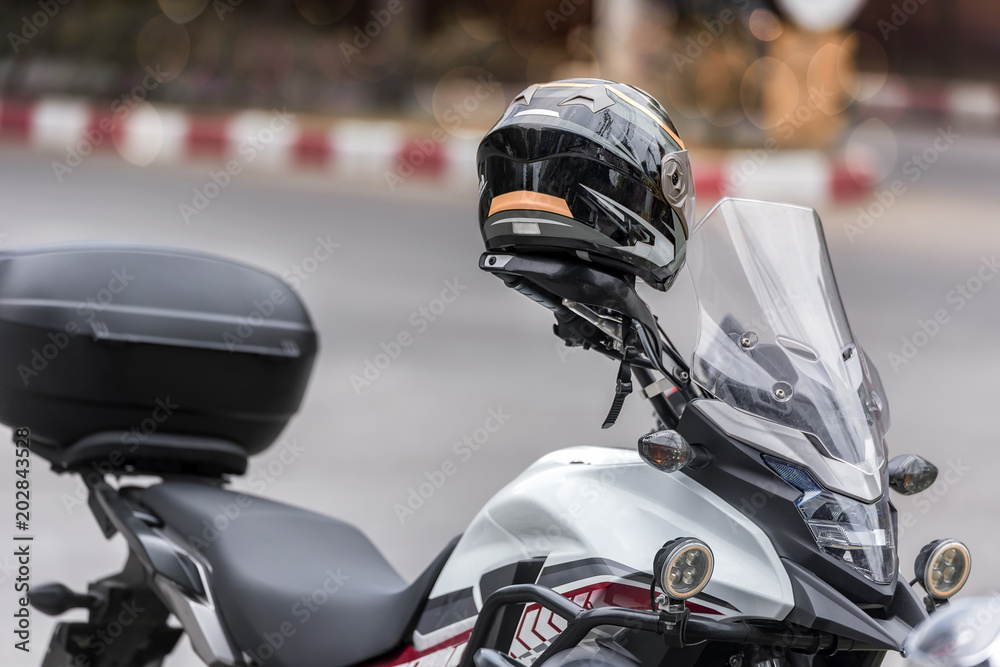 helmet on the handlebars of motorcycle helmet on the handlebars of motorcycle