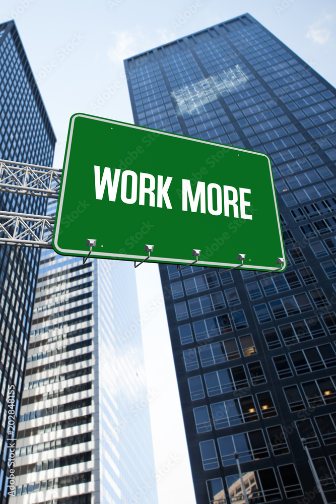 Obraz premium The word work more and green billboard sign against low angle view of skyscrapers