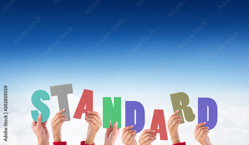 Hands holding up standard against blue sky over clouds Hands holding up standard against blue sky over clouds