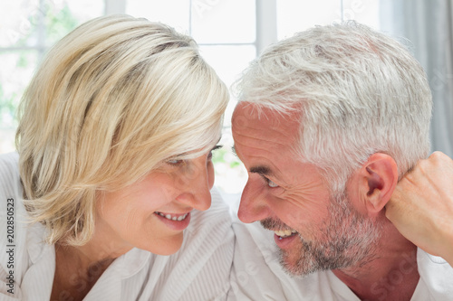 Close-up of a happy mature couple in bed