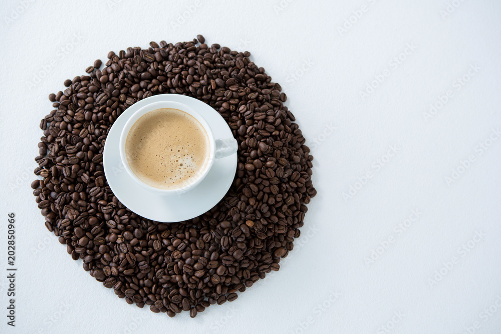 Cup of coffee with roasted coffee beans Cup of coffee with roasted coffee beans