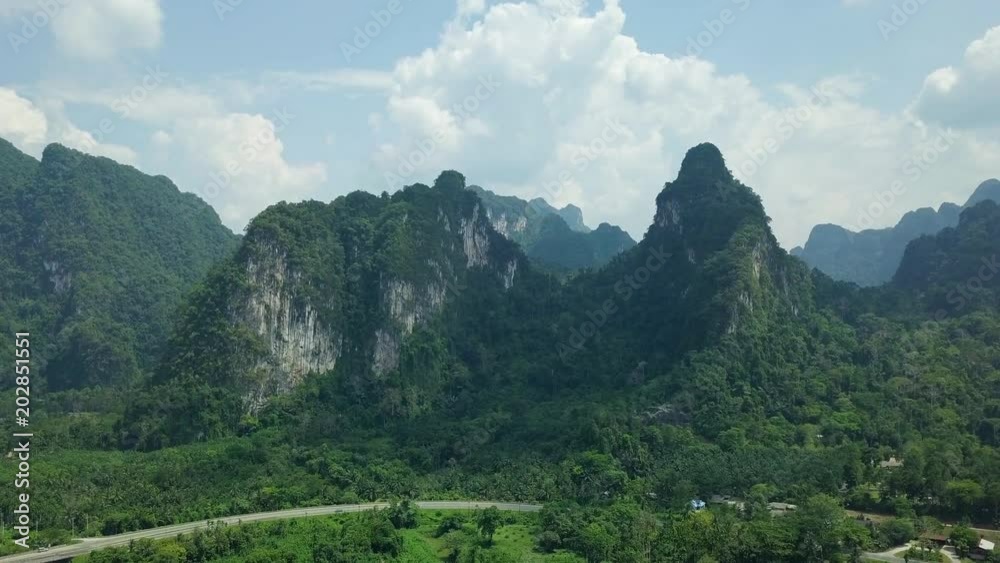 Aerial View of Limestone Rocks Covered with Lush Tropical Greenery. Top View of Mountains in Krabi and Suratthani Provinces, Thailand. Aerial View of Limestone Rocks Covered with Lush Tropical Greenery. Top View of Mountains in Krabi and Suratthani Provinces, Thailand.