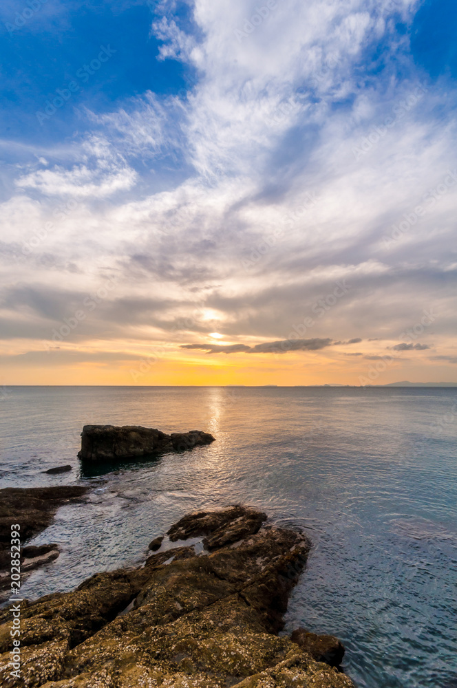 Landscape of beautiful seascape. Sea, rock and cloud in the sky at the sunset. Landscape of beautiful seascape. Sea, rock and cloud in the sky at the sunset.