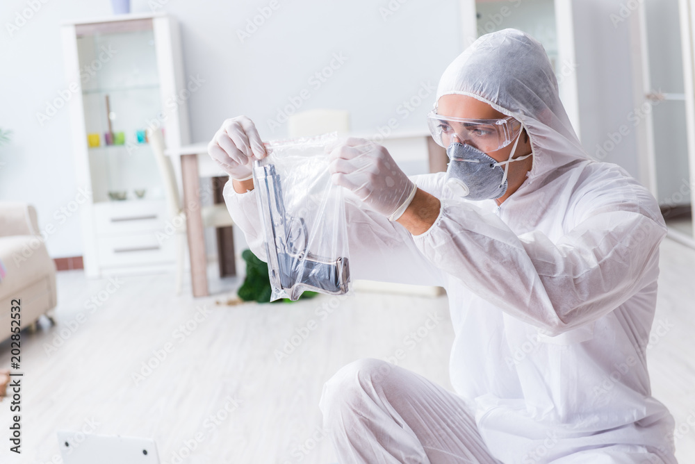 Forensic investigator at the crime scene investigating woman mur Forensic investigator at the crime scene investigating woman mur