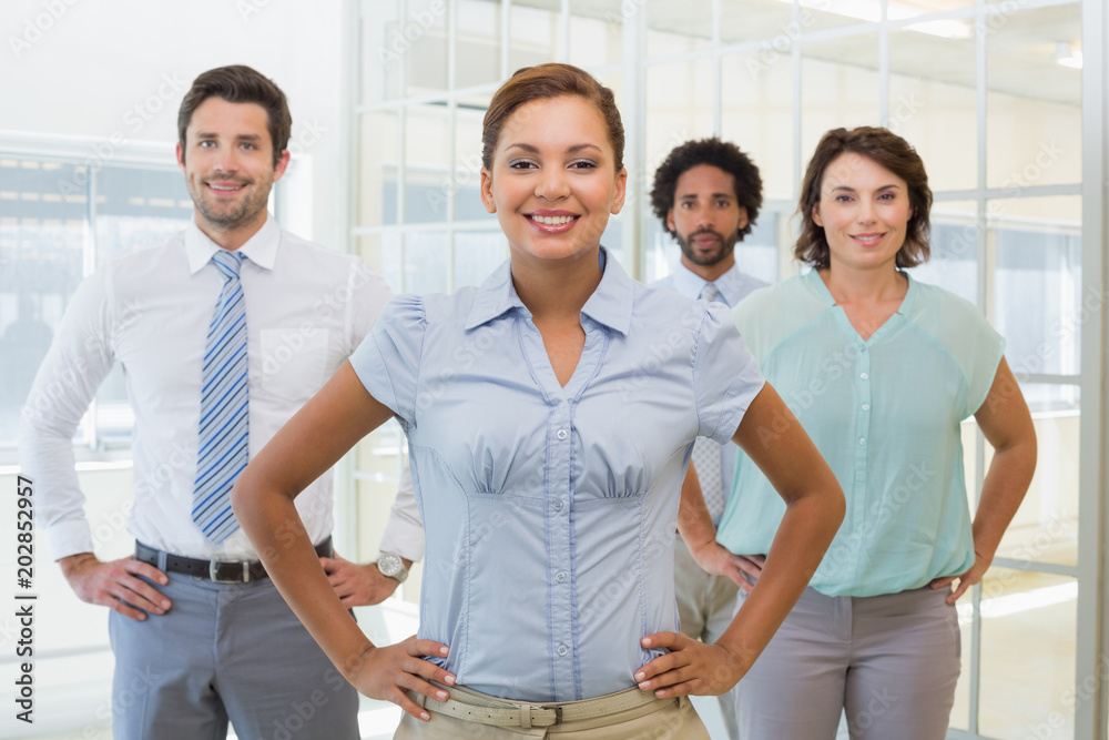 Smiling young businesswoman with colleagues Smiling young businesswoman with colleagues
