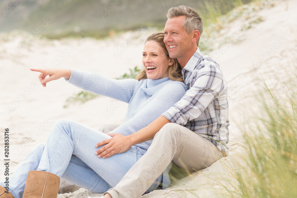 Smiling couple sitting together Smiling couple sitting together