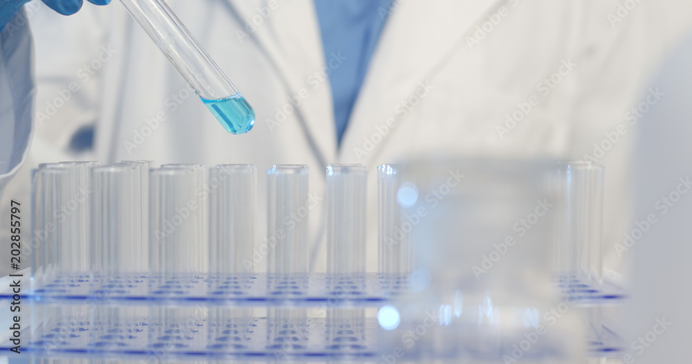 Drop blue liquid in test tube Drop blue liquid in test tube