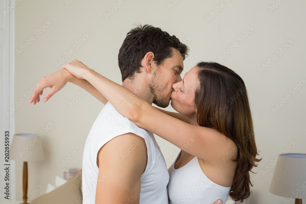 Loving young couple about to kiss at home Loving young couple about to kiss at home
