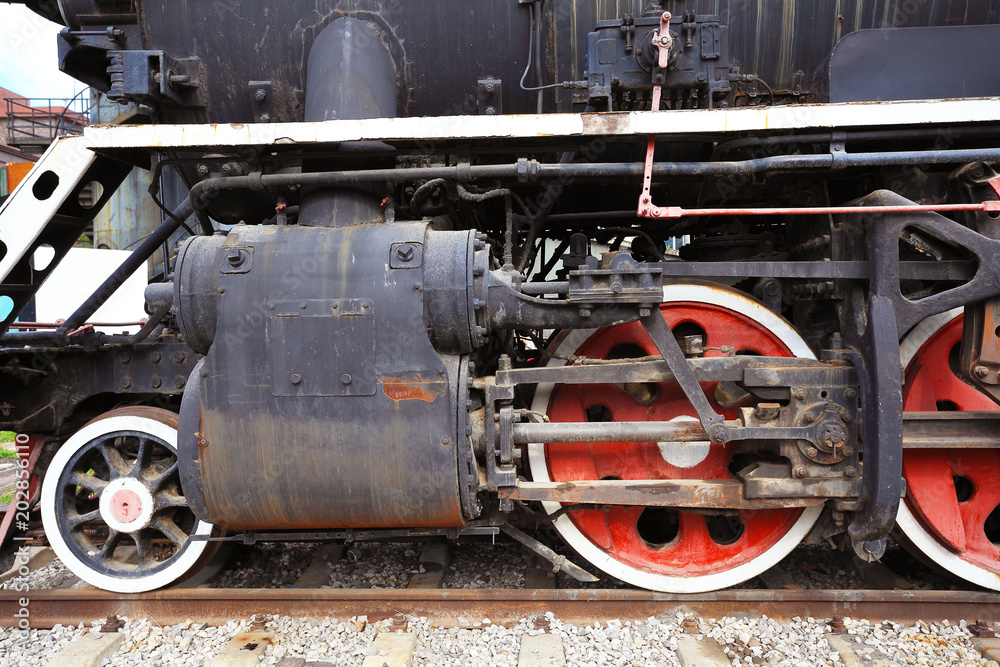 Old black steam train locomotive of partial closeup Old black steam train locomotive of partial closeup