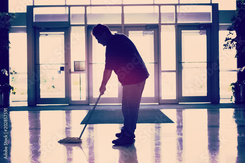 Janitor mopping the floor photo