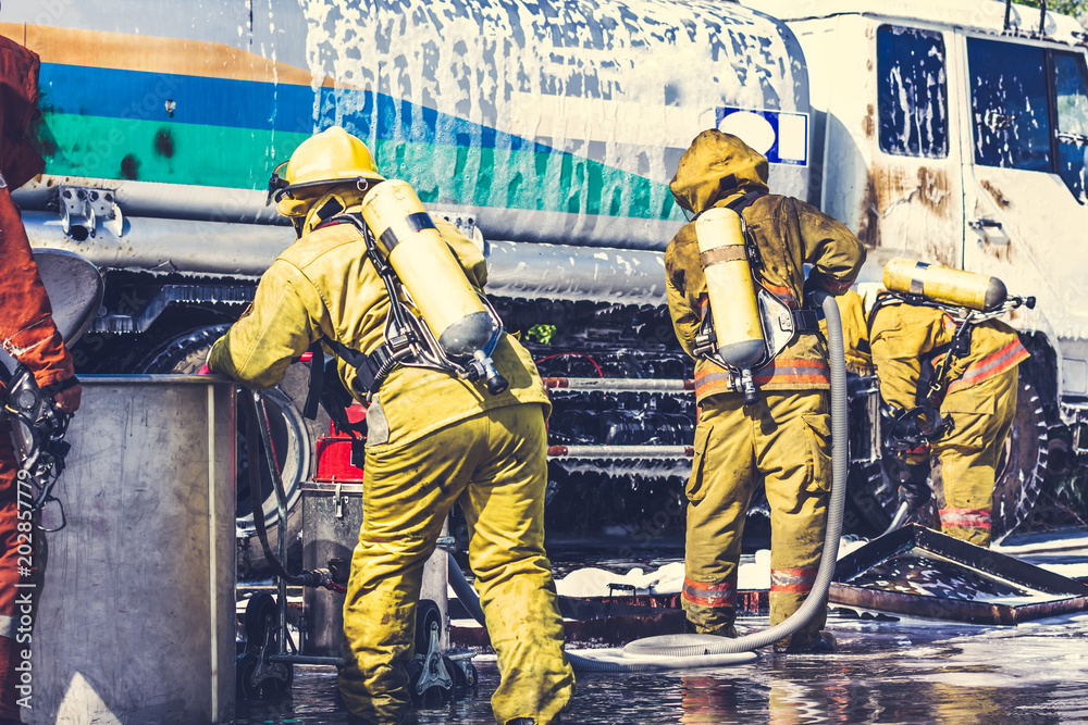 Fototapeta premium Firemen in firefighter uniform are checking their equipment after use.