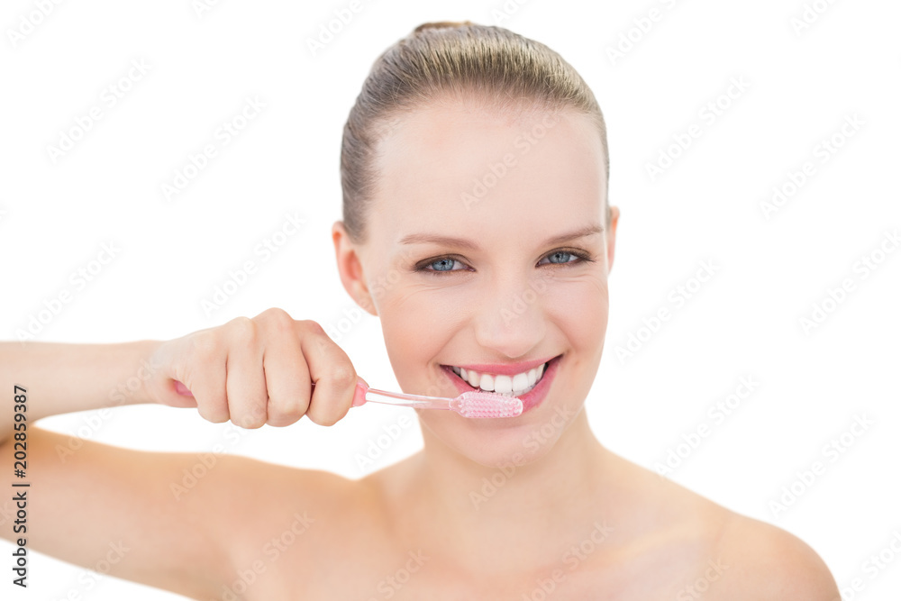 Content pretty blonde model brushing her teeth Content pretty blonde model brushing her teeth