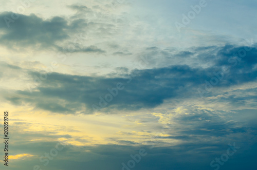 Sky and black clouds on the day of thunderstorms. Shines orange on the clouds