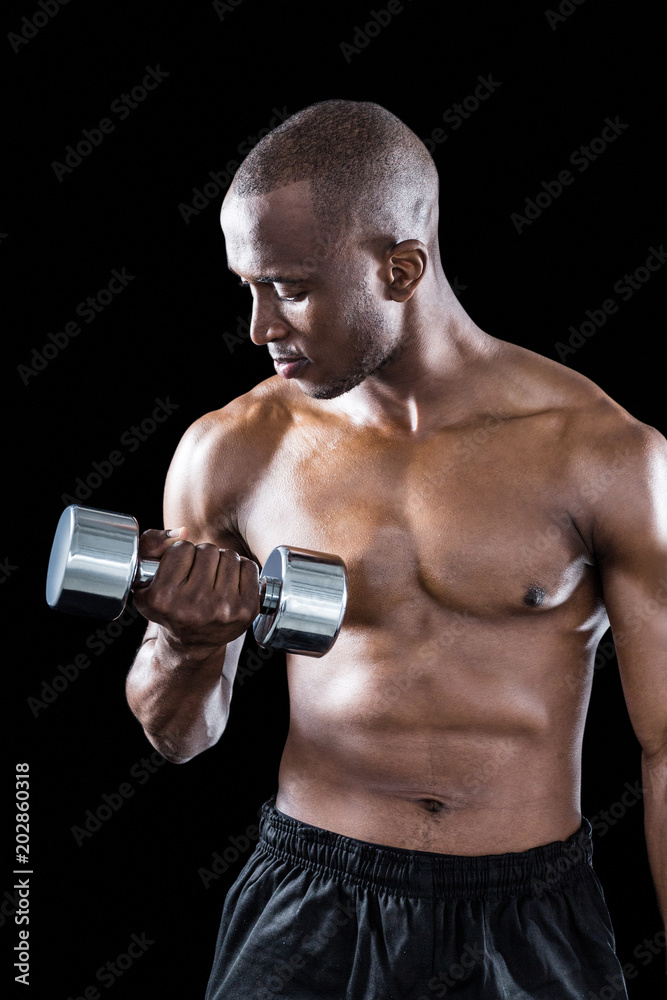 Athlete exercising with dumbbell