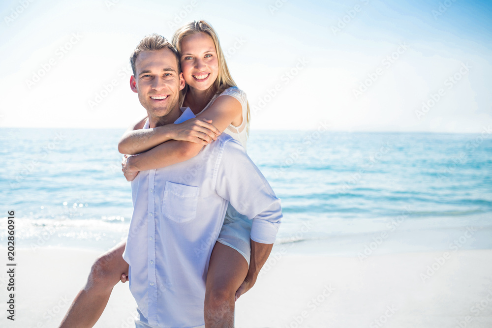  Happy couple having fun on the beach