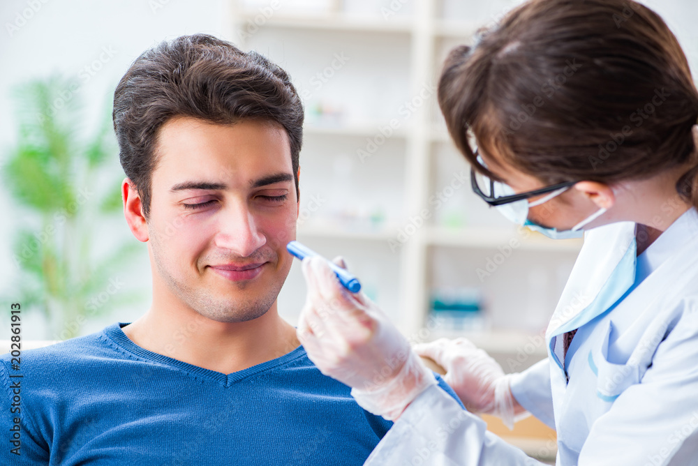 Doctor checking up patient in first aid concept Doctor checking up patient in first aid concept