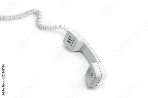 Handset of modern landline telephone on a white background
